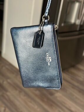 Coach Metallic Navy Pebbled Leather Wristlet hangtag not included.